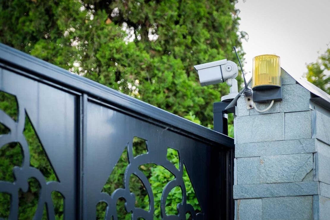 a residential home monitoring system a the front gate of a property